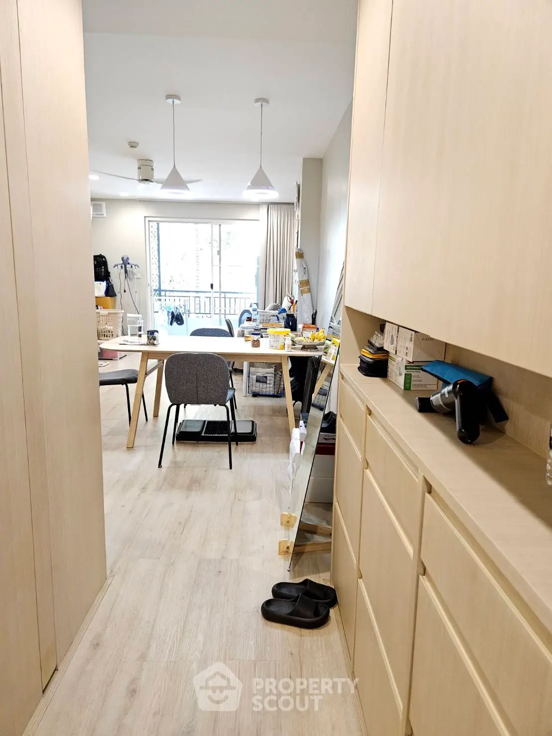 Modern living room with natural light and stylish furniture, perfect for urban living.