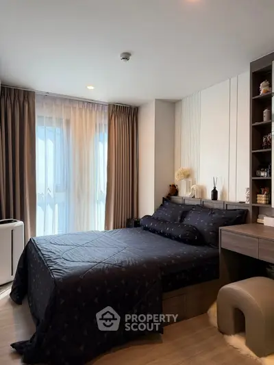 Modern bedroom with stylish decor and natural light