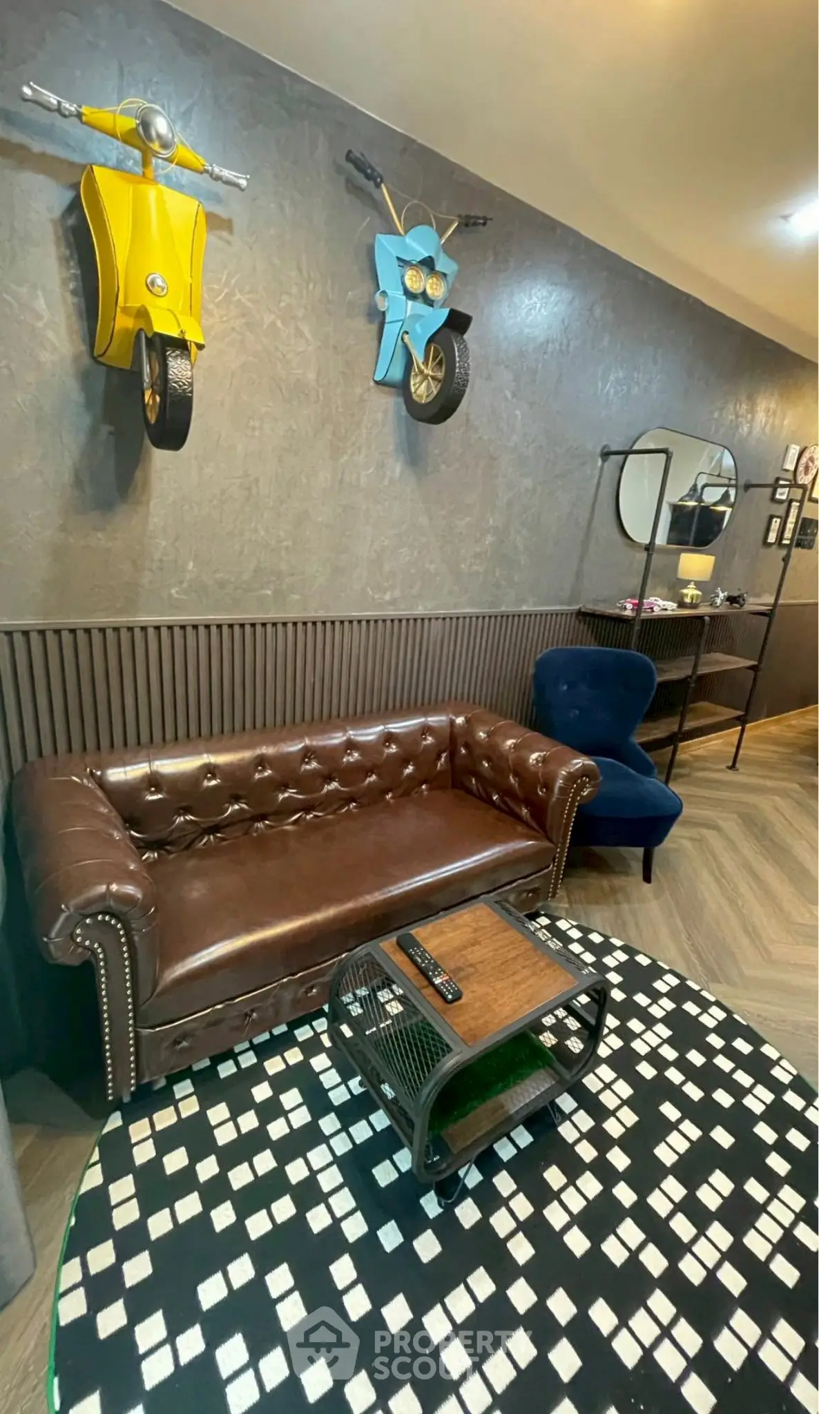 Stylish living room with leather sofa and unique wall decor