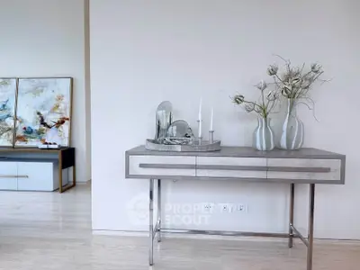Elegant modern interior with stylish console table and artistic decor
