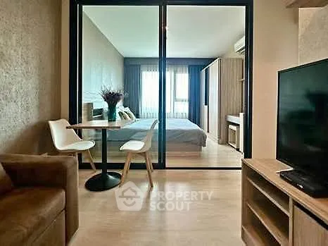 Modern studio apartment with open layout and stylish furnishings