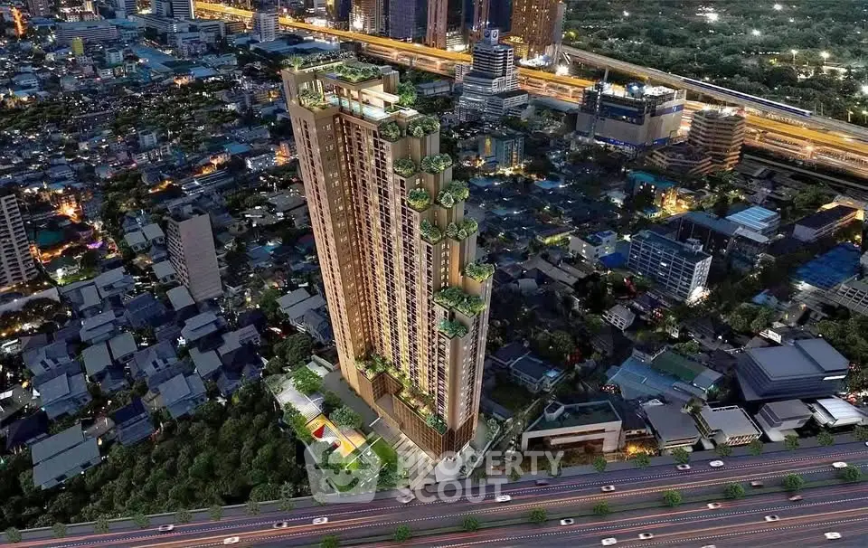 Stunning aerial view of a modern high-rise building in a bustling cityscape, showcasing urban living at its finest.