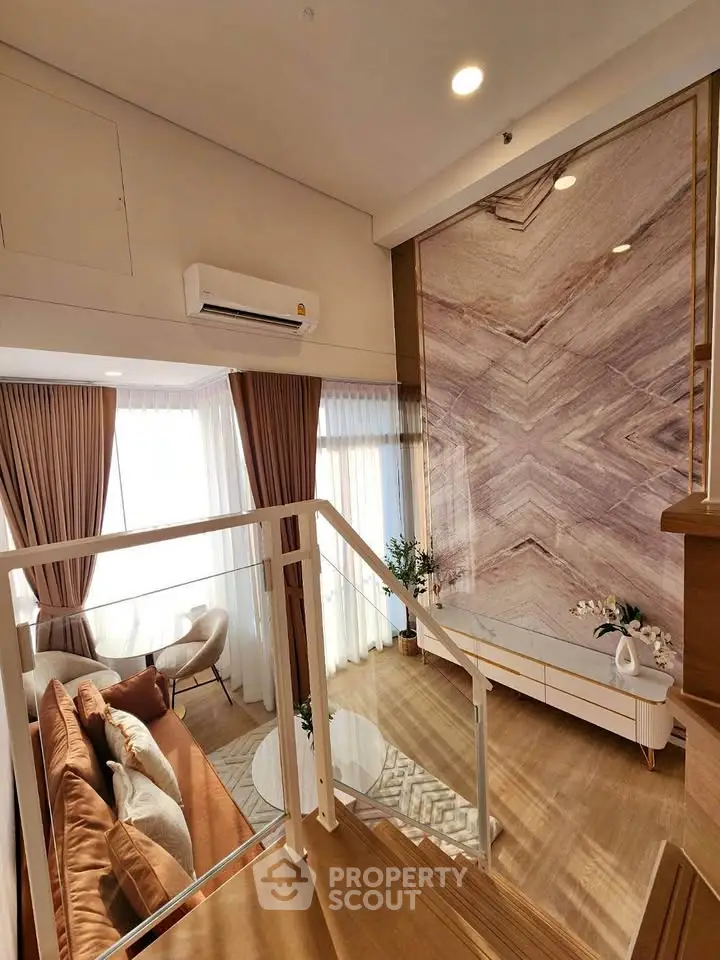 Luxurious duplex living room with elegant decor and natural light