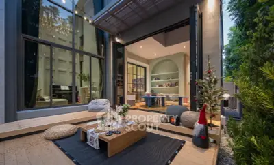 Luxurious modern home with open living space and stylish outdoor patio, perfect for entertaining.