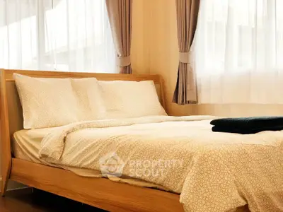 Cozy bedroom with elegant wooden bed and soft lighting