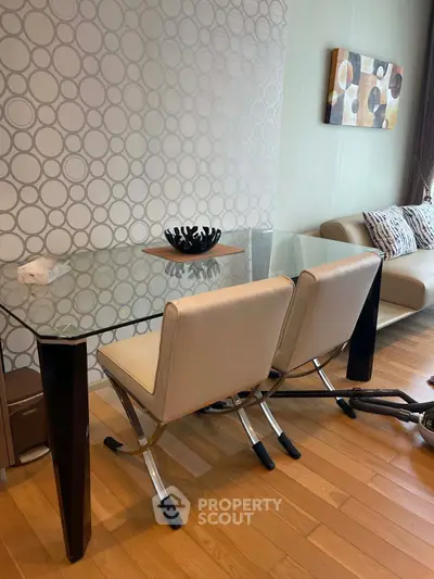 Modern living room with stylish glass dining table and elegant chairs