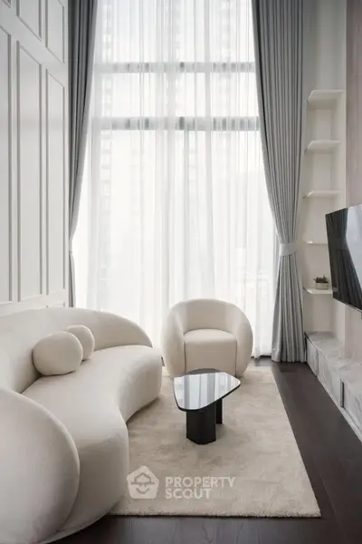Elegant modern living room with high ceilings and stylish furniture