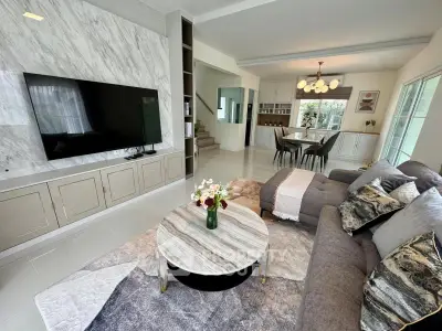 Luxurious open-plan living room with elegant decor and modern amenities