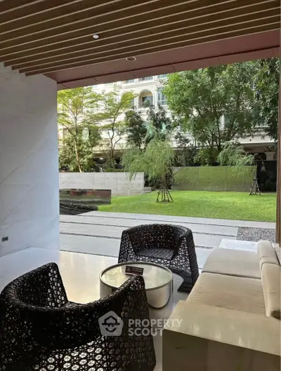 Luxurious modern living room with garden view and stylish furniture