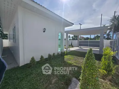 Charming single-story home with lush garden and covered carport in sunny location.