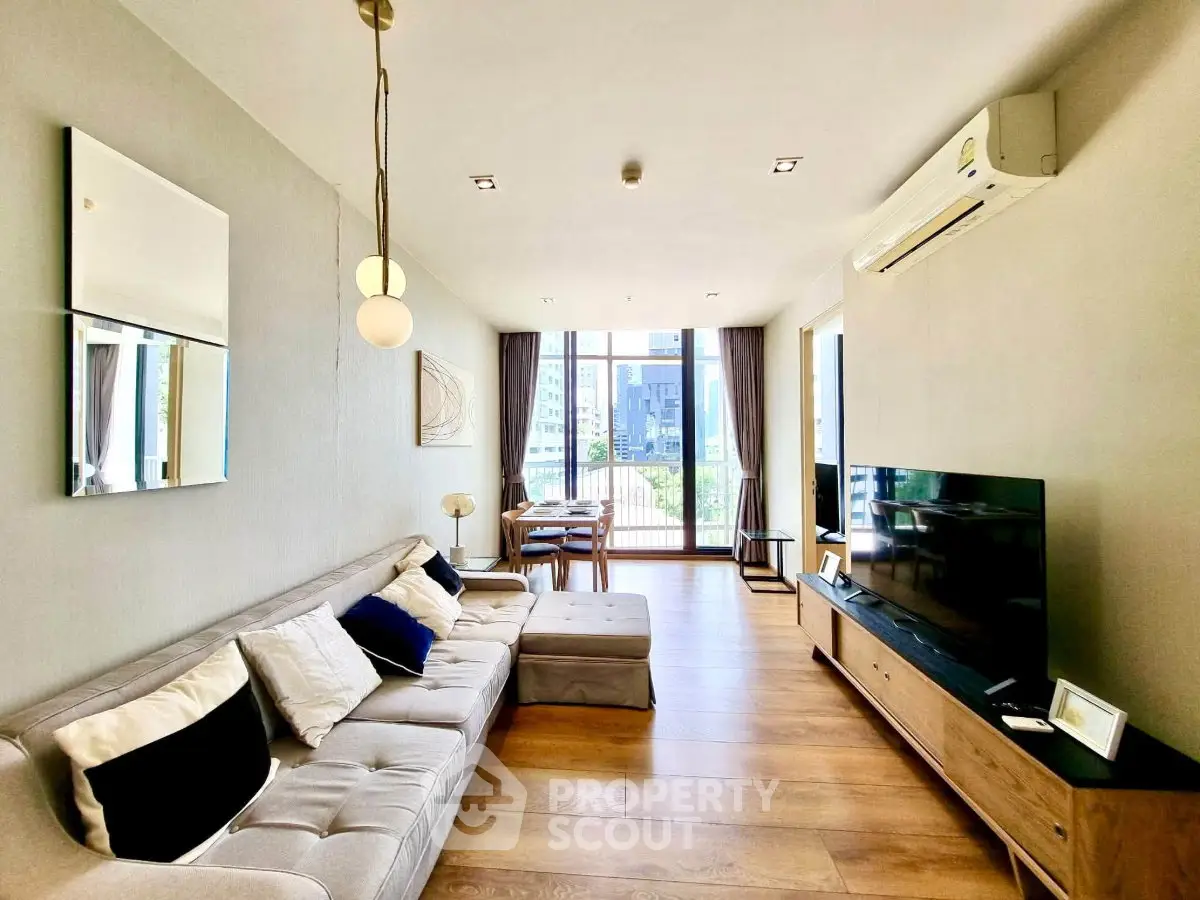 Spacious modern living room with large windows and stylish decor