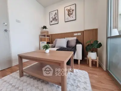 Modern living room with cozy sofa, wooden coffee table, and stylish decor in a bright apartment.