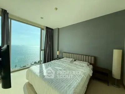 Luxurious bedroom with stunning ocean view and modern decor