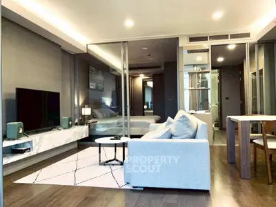 Modern living room with sleek design and cozy ambiance, featuring a spacious layout and stylish furnishings.