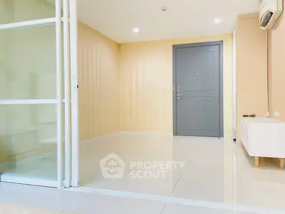 Spacious modern living room with sliding glass doors and neutral decor