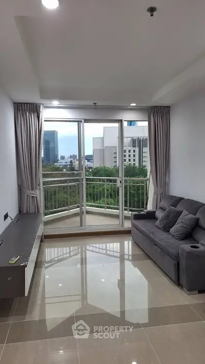 Modern living room with city view and sleek furnishings