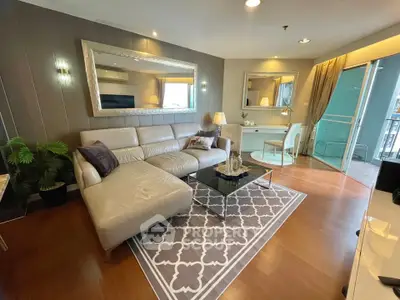 Luxurious living room with elegant decor and spacious balcony access.