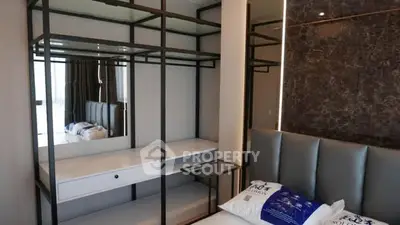 Modern bedroom with sleek storage and stylish decor