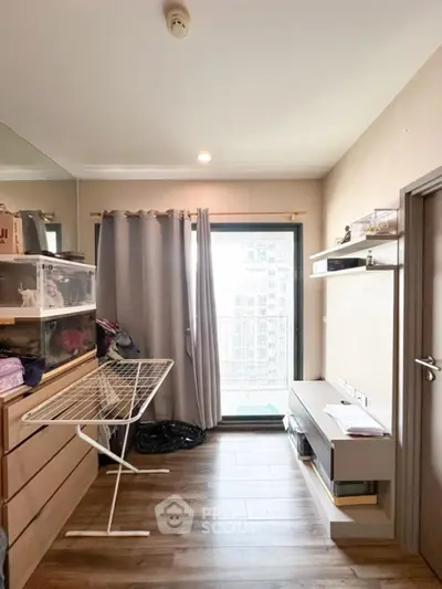 Cozy storage room with wooden flooring and natural light