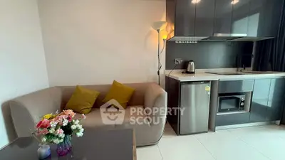 Modern compact kitchen with cozy living area and stylish decor