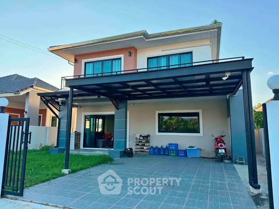 Modern two-story house with spacious driveway and covered parking area, featuring a well-maintained lawn and contemporary design.