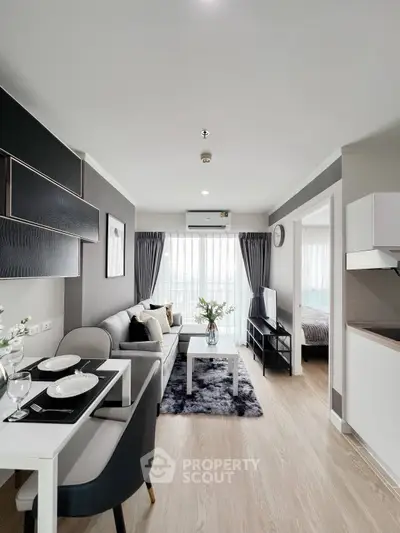 Modern open-plan living room with stylish decor and natural light