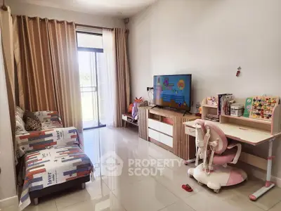 Charming living room with cozy seating and modern TV setup, perfect for family relaxation.