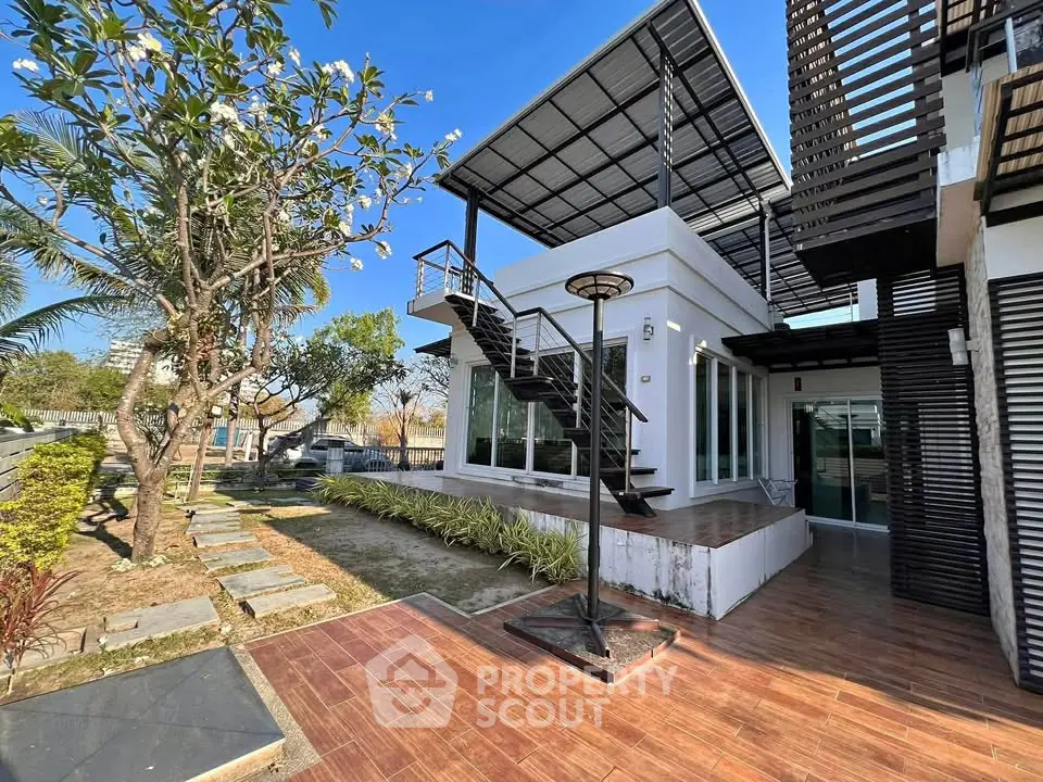 Modern architectural home with sleek exterior and spacious outdoor area
