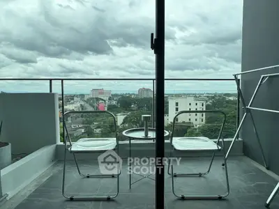 Stunning balcony view with modern seating overlooking cityscape, perfect for relaxation and enjoying the skyline.