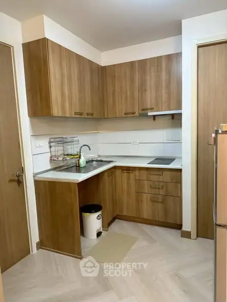Modern kitchen with wooden cabinets and sleek design