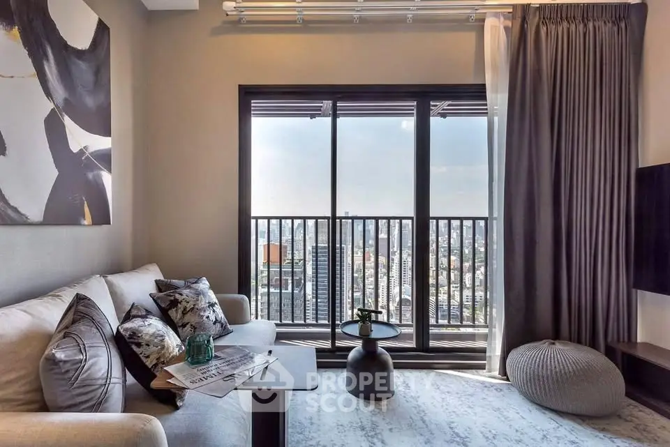 Modern living room with stunning city view from large windows, stylish decor, and cozy seating area.