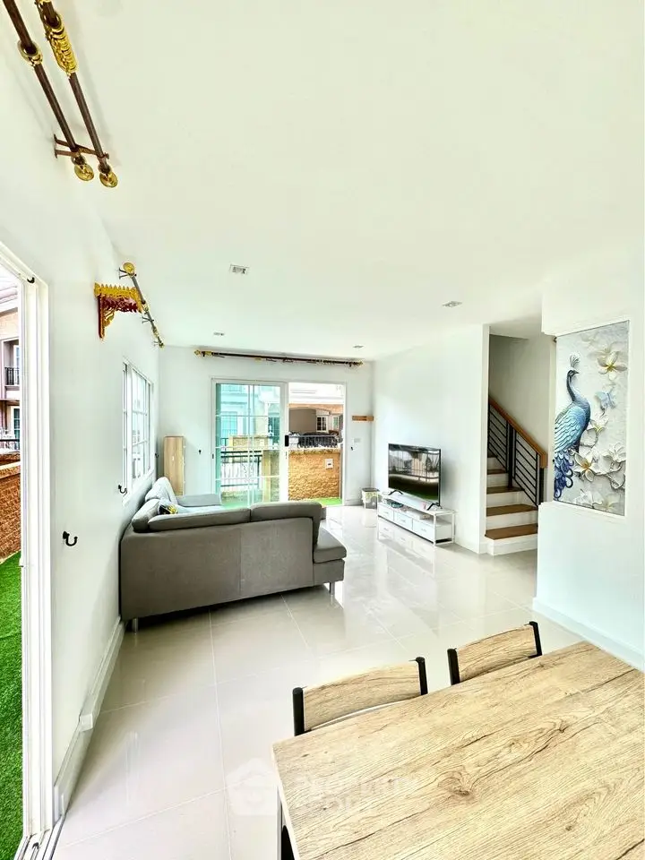 Spacious modern living room with elegant decor and natural light