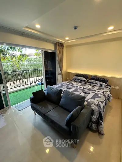 Modern bedroom with balcony access and stylish decor