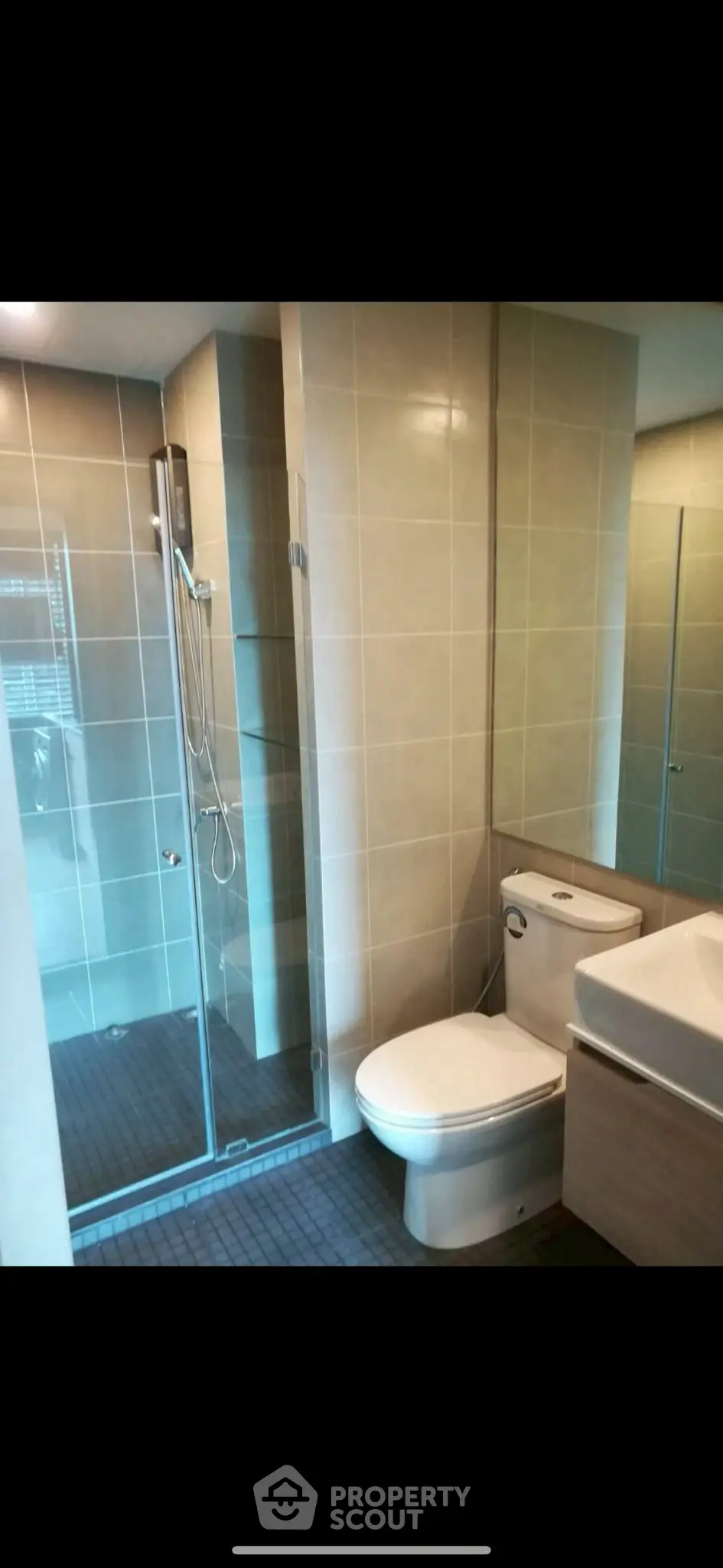 Modern bathroom with glass shower and sleek fixtures
