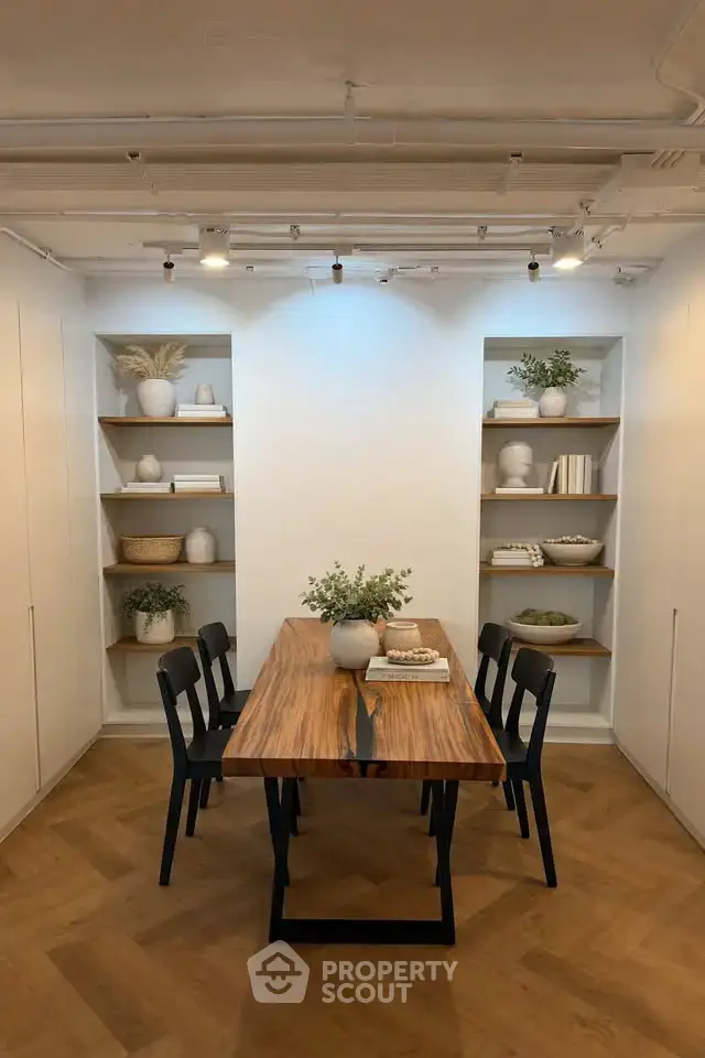 Elegant dining area with wooden table and modern decor in a stylish apartment