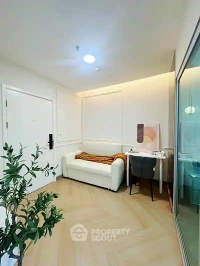 Modern interior with cozy seating area and stylish decor in a bright room.