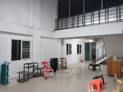 Spacious open-plan interior with modern staircase and ample natural light