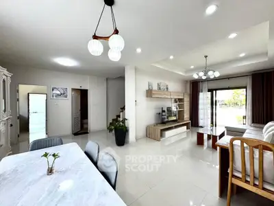 Spacious modern living room with elegant dining area and natural light
