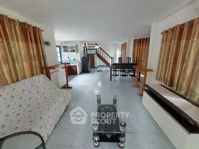 Spacious living room with elegant decor and ample natural light