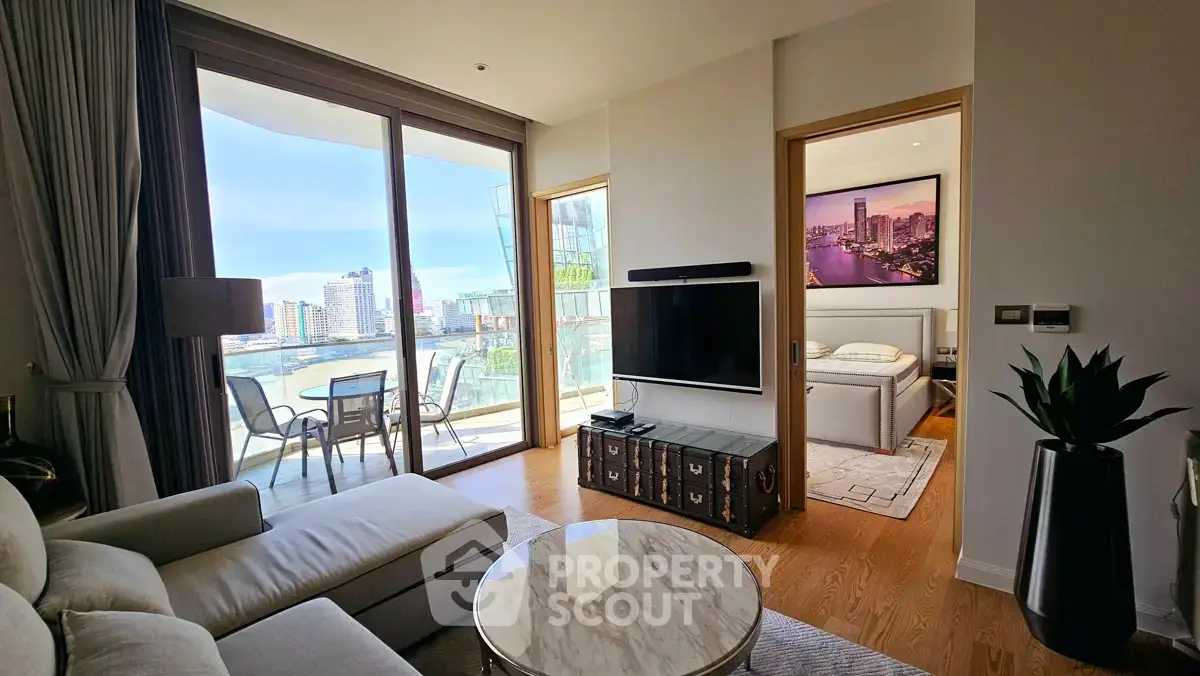 Modern living room with balcony view and adjacent bedroom in luxury apartment