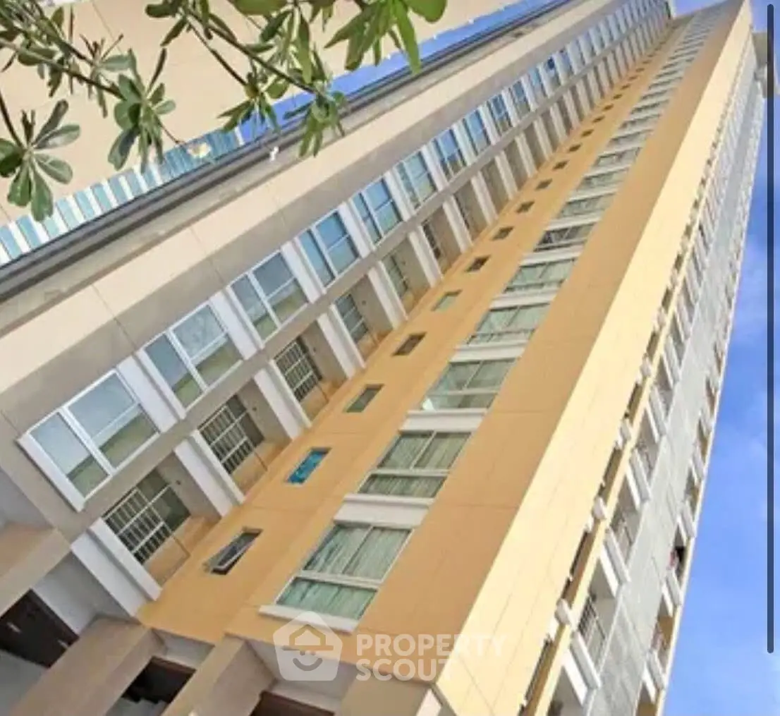 Stunning high-rise building exterior with modern architectural design and expansive windows.