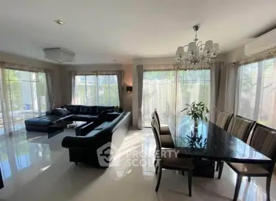 Spacious modern living room with elegant dining area and natural light