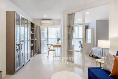 Modern open-plan living room with glass sliding doors and stylish furniture