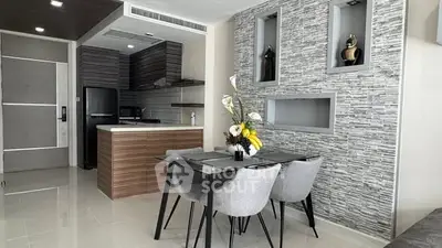 Modern kitchen and dining area with stylish decor and sleek finishes.