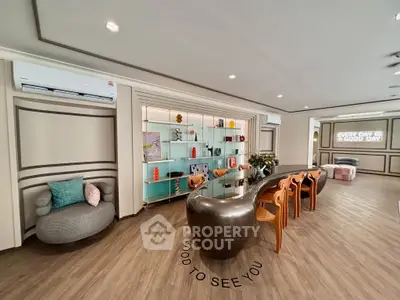 Luxurious modern living room with stylish furniture and elegant decor, perfect for entertaining guests.