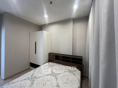 Modern bedroom with stylish decor and ample natural light