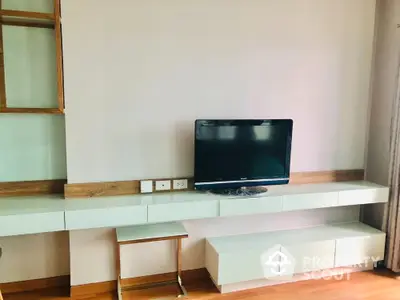 Modern living room with sleek TV stand and wooden accents