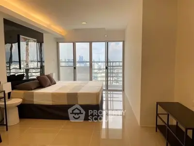 Spacious bedroom with panoramic city view and modern decor
