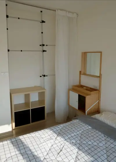 Cozy bedroom with minimalist furniture and natural light