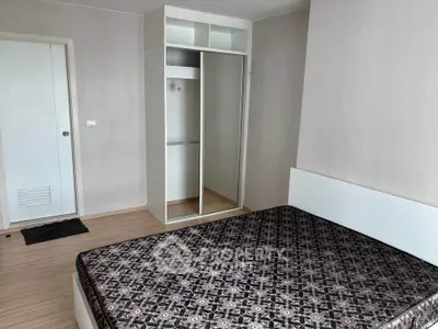 Spacious bedroom with modern wardrobe and stylish decor